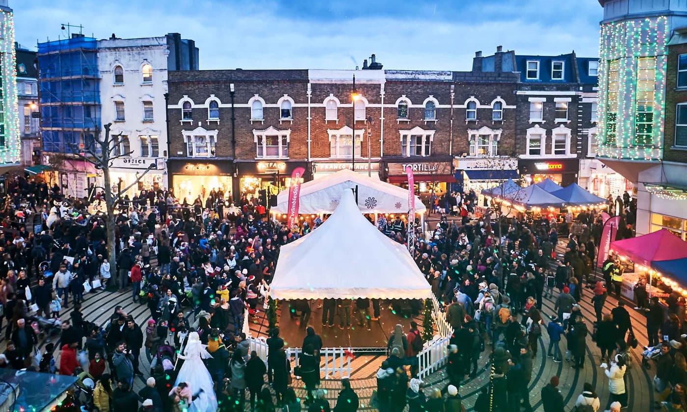 a business event with a large audience, a stage and a big screen